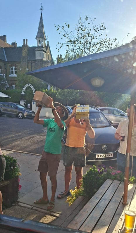 Eclipse watchers near a pub in Kentish Town, north London