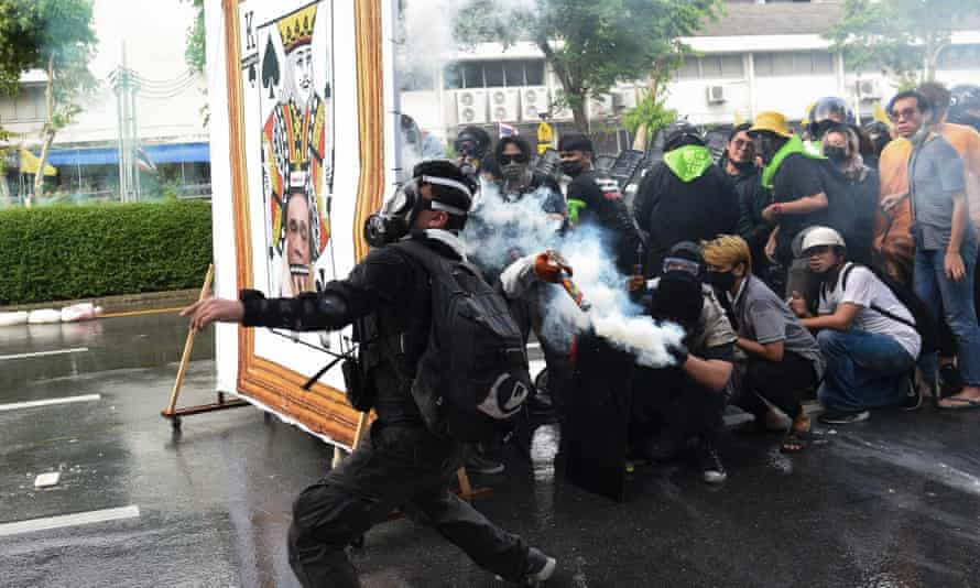 An anti-government protester in Bangkok throws back a teargas canister as demonstrators call for the resignation of Thailand’s prime minister Prayut Chan-O-Cha.
