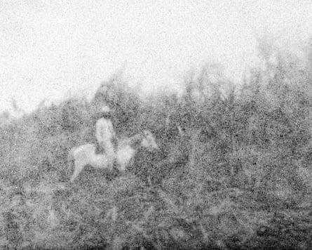 A sugar depiction of a man on a horse in a field