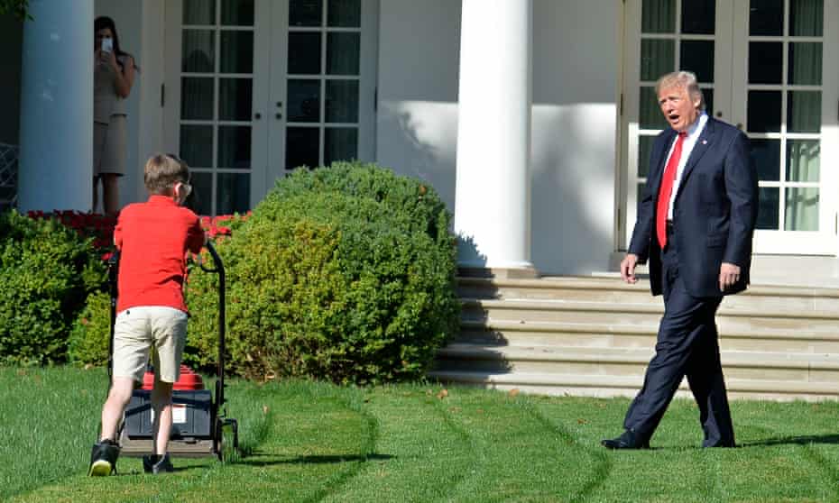 Donald Trump watches Frank Giaccio, 11, as he mows the lawn in the Rose Garden