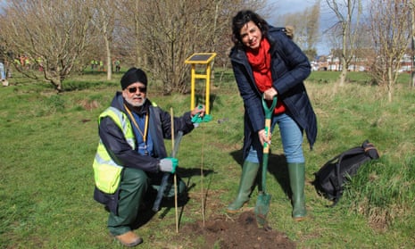 Bali Singh Panesar, of Sikh Union Coventry, and Nav Mann, a Coventry 2021 UK city of culture official, plant trees in the city.