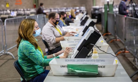 Poll workers tabulate ballots at the Allegheny county election warehouse in Pittsburgh, Pennsylvania, on 6 November. 