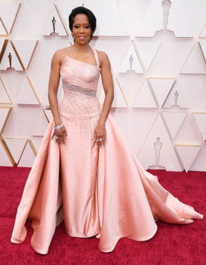 It was raining on the red carpet, but Regina King looked resplendent in this fitted pale pink number.