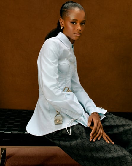 Shirt and corset: Fendi. Trousers: Gucci. Jewellery: Cartier.