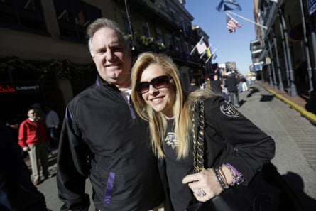 Sean and Leigh Anne Tuohy stand on a street in New Orleans in 2013. A Tennessee judge said on Friday that she is ending a conservatorship agreement between former NFL player Michael Oher and the Tuohys, who took him in when he was in high school.