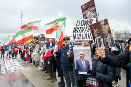 Protesters with posters and Iranian flags