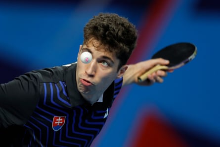 Jakub Zelinka of Slovakia serves to an opponent from Guatemala