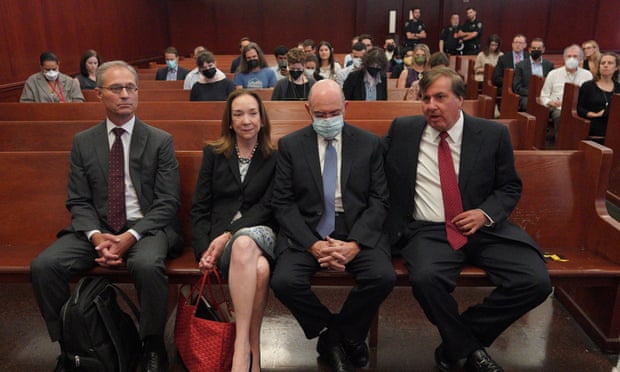 Allen Weisselberg (in mask) with his legal team before a hearing at Manhattan State Supreme Court in New York, 18 August 2022.