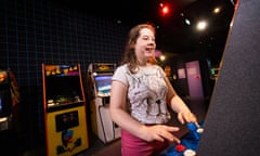 A girl plays an arcade machine at Game On at the National Museum of Scotland.
