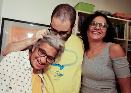 Alaa Abd el-Fattah stands next to his mother, Laila Soueif, and sister, Sanaa, at their home in Giza.