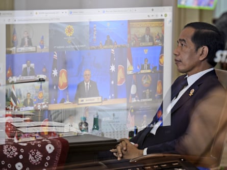 Joko Widodo, president of Indonesia, listens while Scott Morrison speaks during a virtual meeting of the Asean-Australia summit in Jakarta, Indonesia, 27 October 2021.