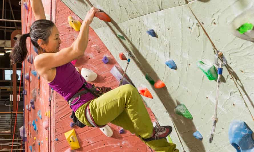 Woman indoor climbing