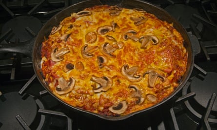 Double cook pizza by giving it a few minutes in a frying plan before putting it in the oven