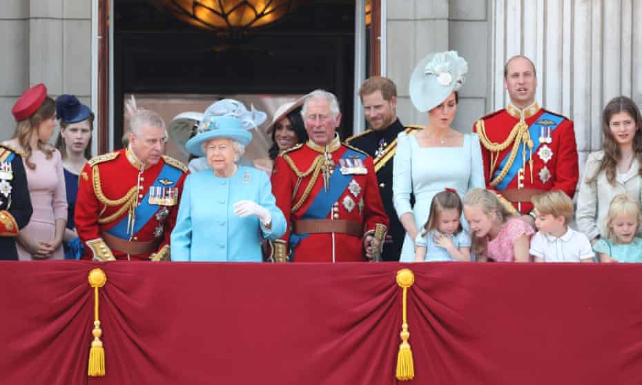 Prince Andrew talks with the Queen as the royal family wave from the balcony of Buckingham Palace after Trooping the Colour in June 2018. 