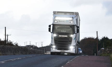 A lorry followed by cars crosses the border between Ireland and the UK in 2020 in Newry, Northern Ireland.