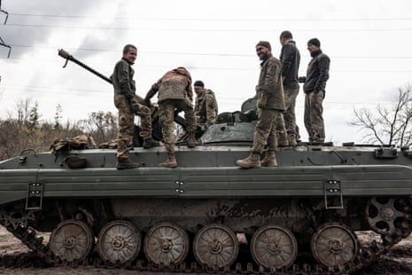 Ukrainian soldiers stand on a BMP during a training in Donetsk.