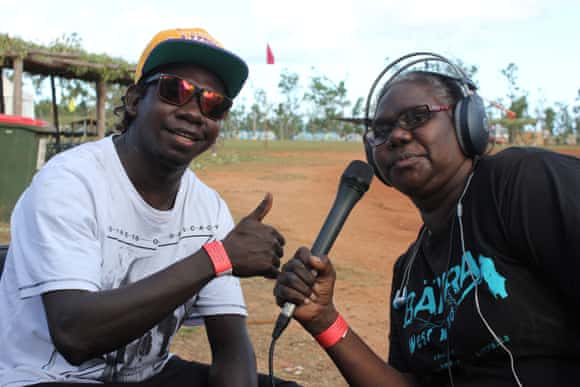 Sylvia Ŋulpinditj, an announcer for Yolŋu Radio, conducts an interview in the field