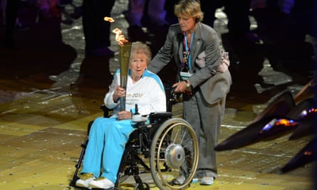 Margaret Maughan carrying the flame during the opening ceremony of the London 2012 Paralympics.