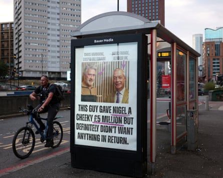 A poster on the side of a bus shelter that features a photo of Harborne and Farage