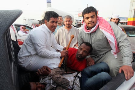 Police detain illegal African immigrants near Thamama, in the Saudi capital Riyadh