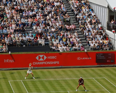 A packed Court One crowd watches Katie Boulter and Emma Raducanu during their doubles match