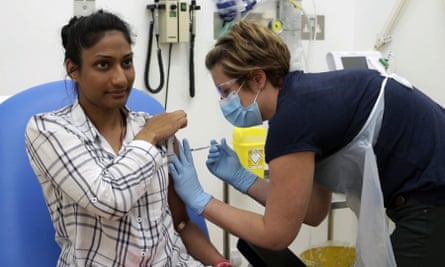 A volunteer is injected during the first human trials in the UK to test a potential coronavirus vaccine.