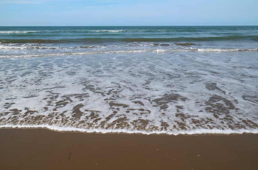 Standing on the shoreline at Ynyslas.