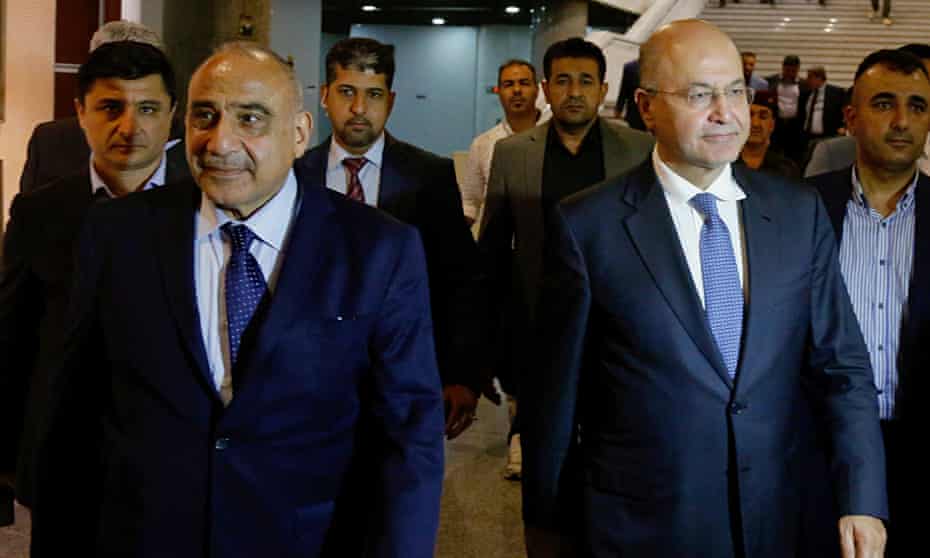 Iraq’s new prime minister, Adel Abdul-Mahdi, front left, with, right, the country’s president, Barham Salih.