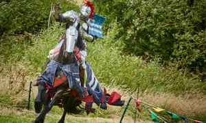 Knights on horseback taking part in a medieval jousting tournament