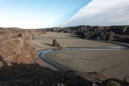 A dried up river between rocky banks