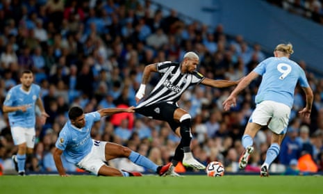 Thou shall not pass: Newcastle United's Joelinton in action with Manchester City's Rodri and Erling Braut Haaland.