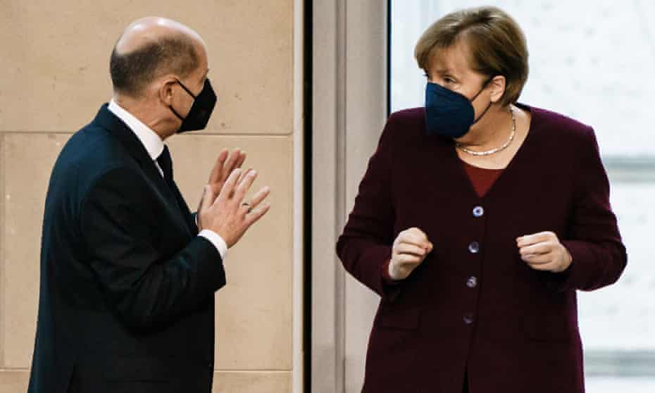 Olaf Scholz is seen with Angela Merkel