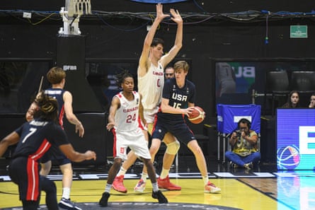 Olivier Rioux guards the 7ft 3in Daniel Jacobsen during an under-18 game between USA and Canada.
