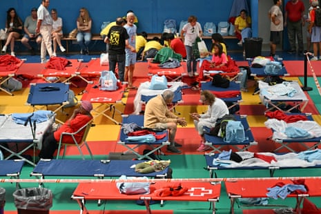 Evacuees in a sports hall in Villaviciosa de Odon, 20 kms west of Madrid.