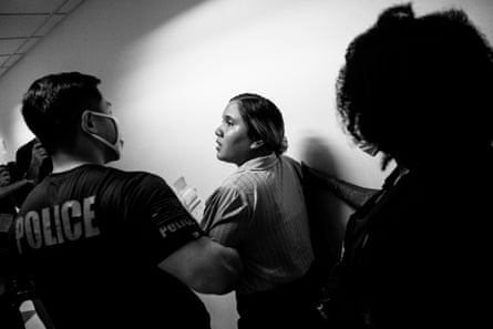 A man pulls a woman to a stairwell