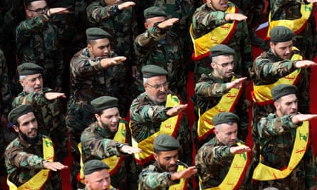 Hezbollah fighters salute