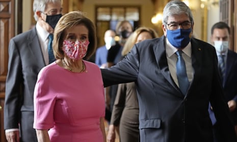 Nancy Pelosi walks with the Portuguese Parliament Speaker Eduardo Ferro Rodrigues during a visit to the parliament in Lisbon yesterday.