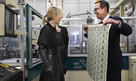 Louise Linton and Steven Mnuchin react as he holds up a sheet of freshly printed dollars.