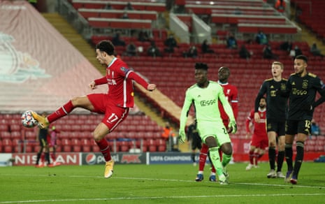 Liverpool’s Curtis Jones scores after an error by Onana.