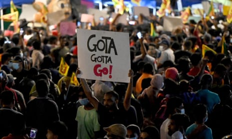 Protester holds a sign saying 'Gota gotta go'