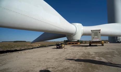 A wind turbine blade sits on the ground