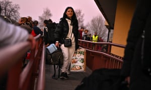 People, mainly women and children, arrive at Przemysl train station after travelling on a train from war-torn Ukraine on March 22, 2022 in Przemysl Poland.