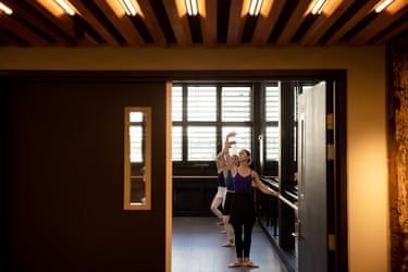 A colour photograph of dancers practicing in a ballet dance class