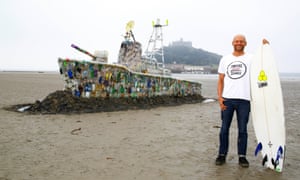 Hugo Tagholm, of Surfers Against Sewage, with a model ship made of plastic marine litter.