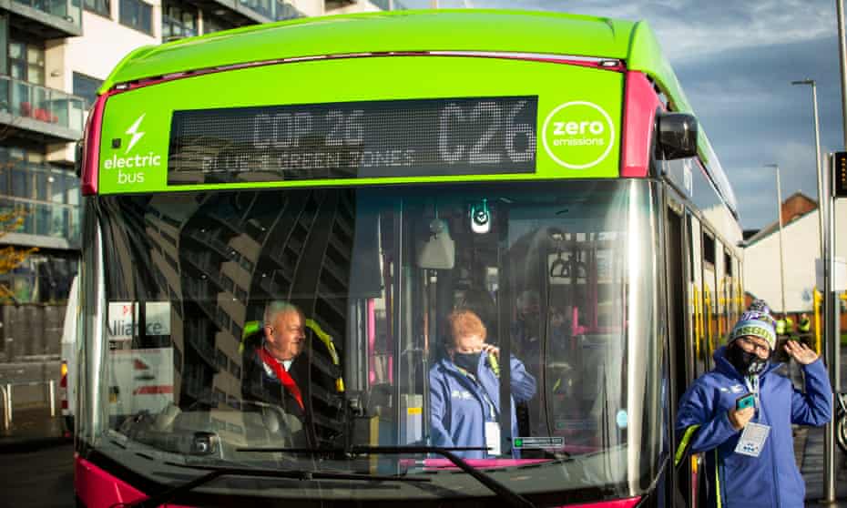 Cop26 volunteers arrive on an electric bus