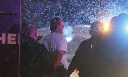 A suspect is taken into custody outside the Planned Parenthood centre in Colorado Springs, Colorado on Friday 27 November.