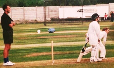 Kate Cross bowling while dad David Cross umpires