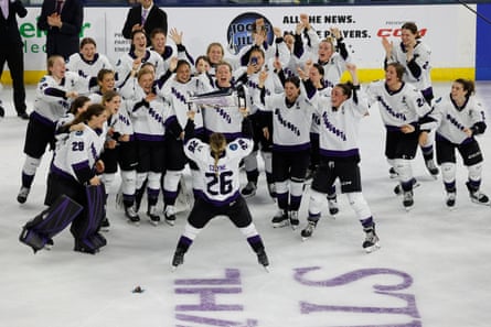 Minnesota captain Kendall Coyne Schofield (26) takes the trophy to her team after defeating Boston to win the Walter Cup on Wednesday night.