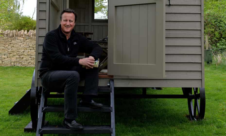 David Cameron on the steps of his luxury garden hut