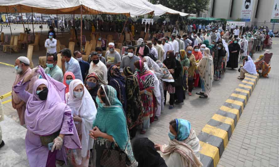 People queue for Covid vaccination in Lahore, Pakistan